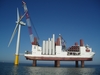 A jack-up barge installs an offshore wind turbine