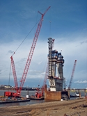 Massman's Manitowoc 7000 pedastal crane installing a pylon's rebar