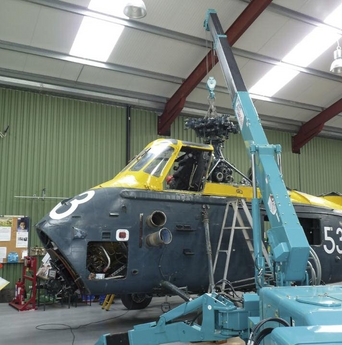 A Maeda minicrane lifts part of a helicopter at the the world's largest dedicated helicopter museum, in Weston-super-Mare in southwest England.